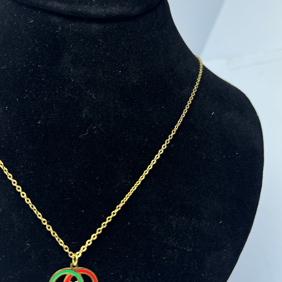 Gucci logo pendant with golden chain