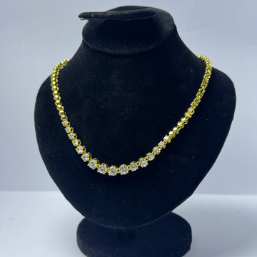 Golden necklace with white stones